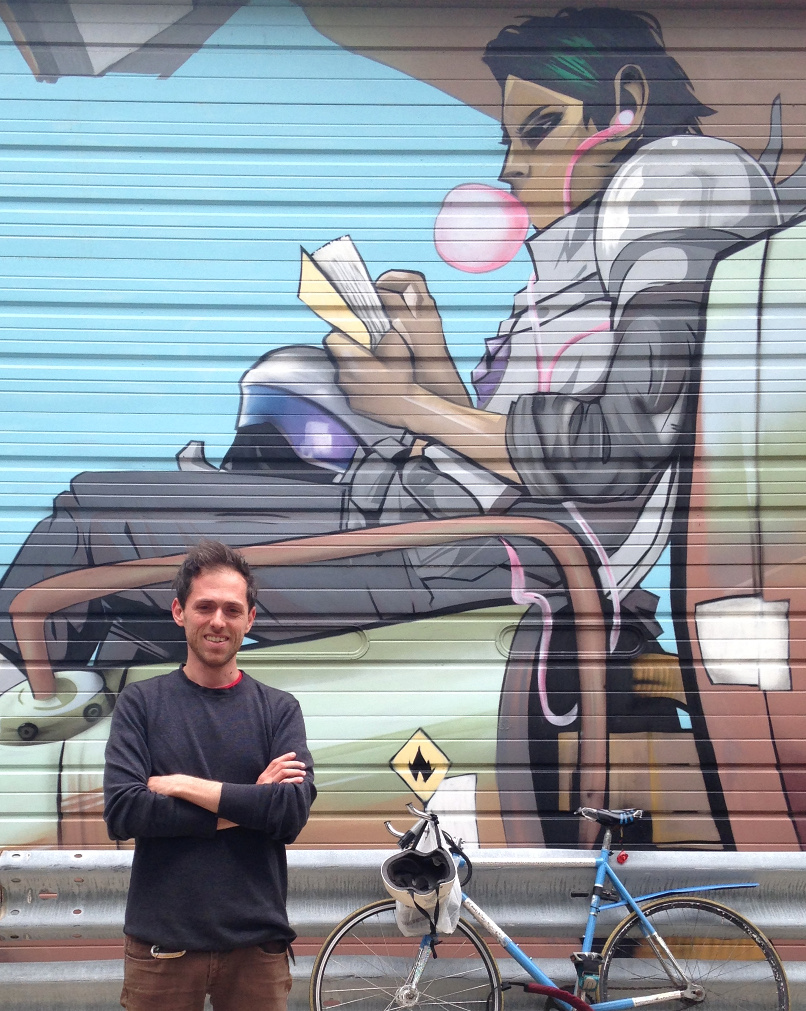 Image of Marc in front of Saga mural in Chicago